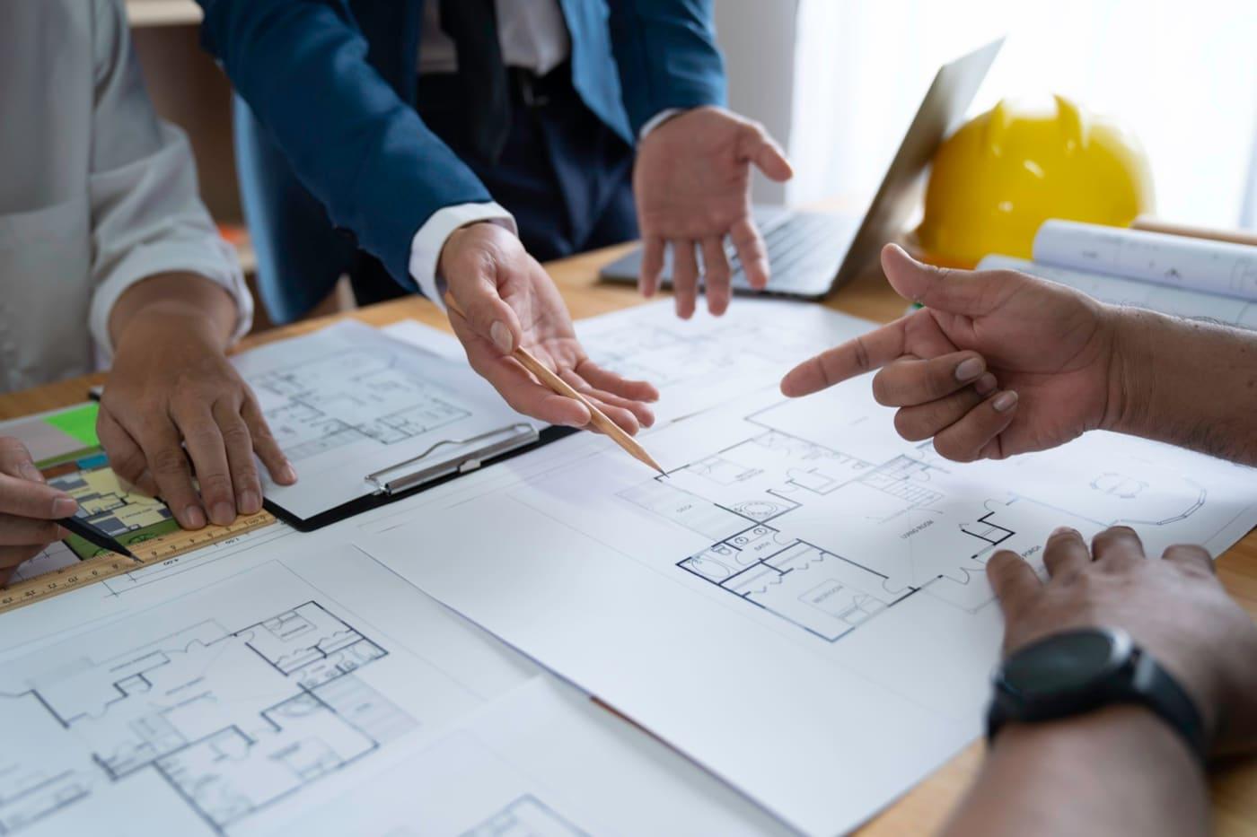 Feasibility meeting over the drawings of a detached house